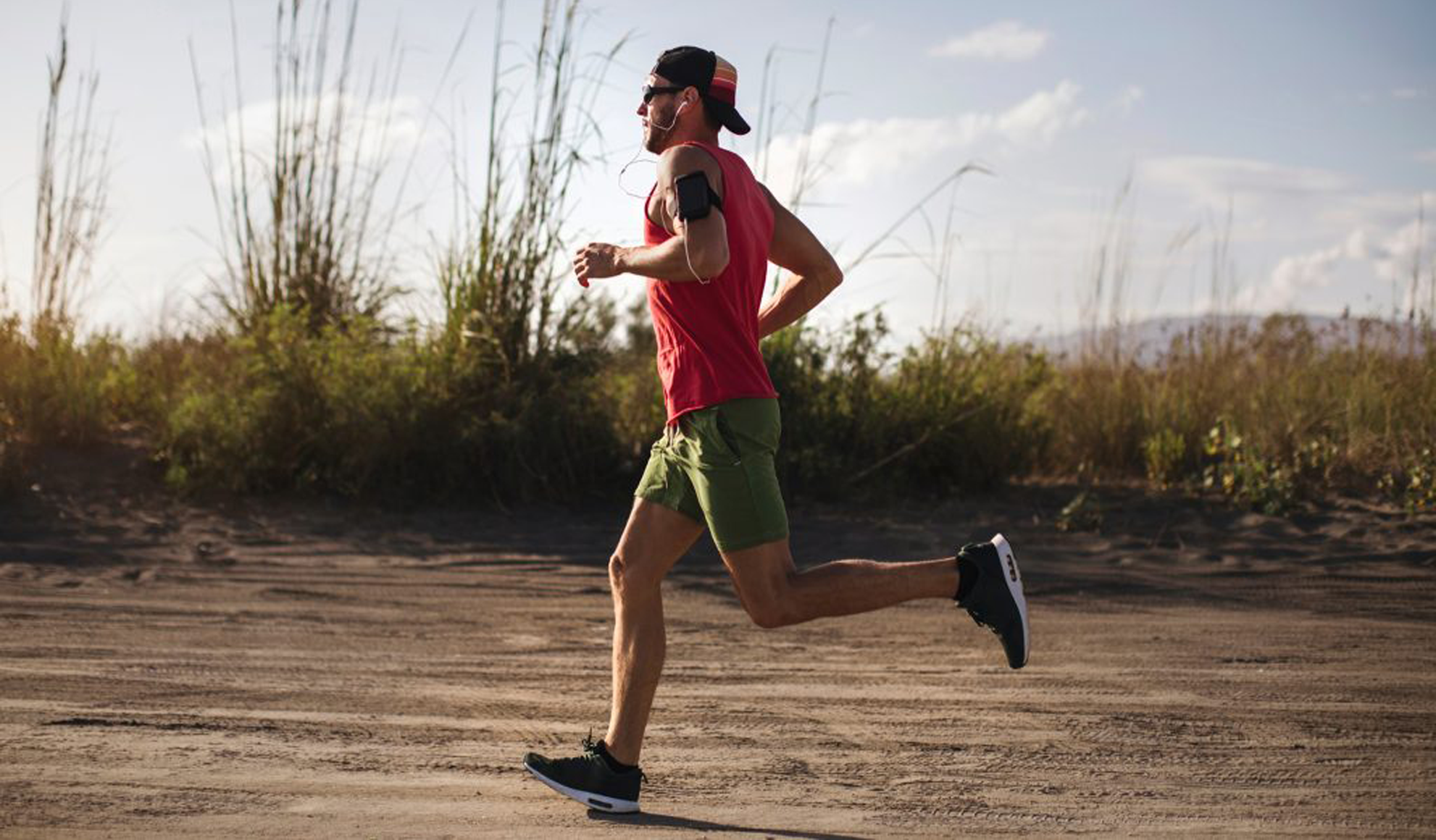 Man running outdoors, symbolizing increased energy, vitality, and overall wellness supported by ozone therapy at BionwoRx: Center for Functional and Regenerative Medicine in Carmel, Indiana.